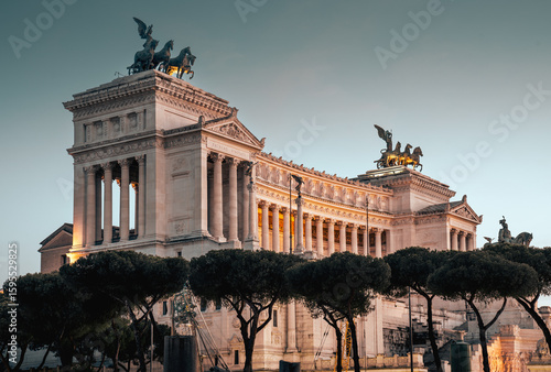 View of the Altare della Patria. The famous building in Emmanuel II Square illuminated at night.