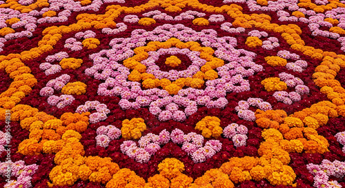 Aerial view of a floral arrangement featuring orange pink and red flowers in a circular pattern ai genrated