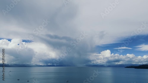Snow storm arriving over South Lake Tahoe looking toward Heavenly Valley on a cold May day with snow and freezing rain Drone footage