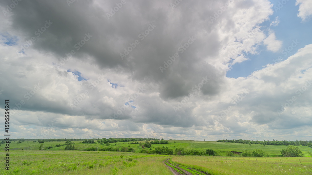 Obraz premium A Beautiful Overcast Landscape Featuring Lush Green Fields That Captivates and Inspires