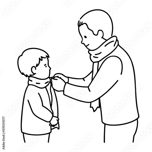 Father tying scarf on son to keep warm during winter season  