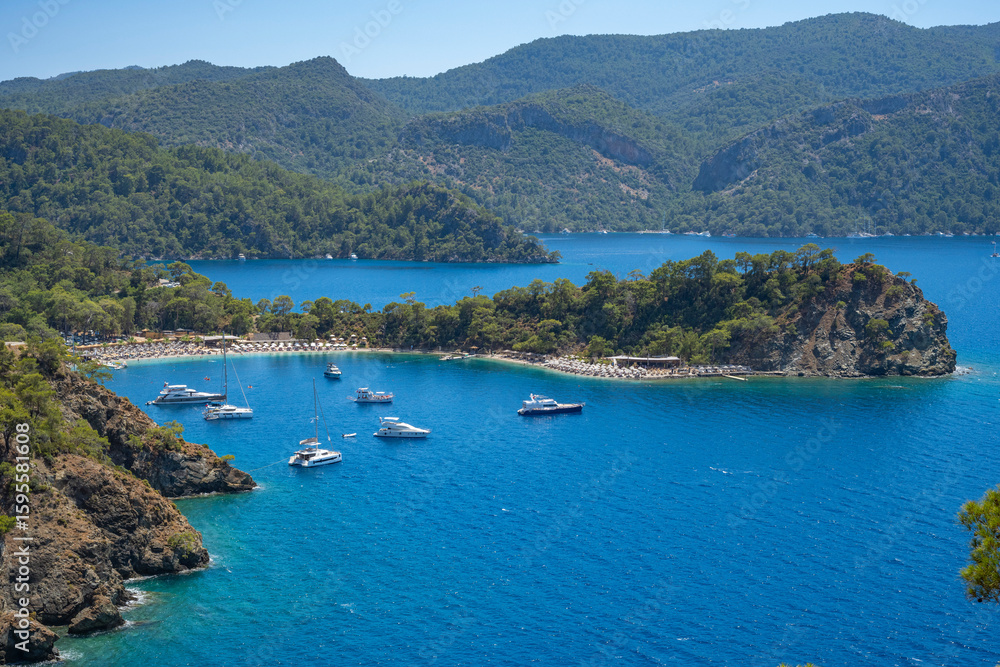Obraz premium Boncuk Bay, Blue Lagoon and Oludeniz beach aerial panoramic view. Oludeniz is a beach resort in the Fethiye district of Mugla Province, Turkey.