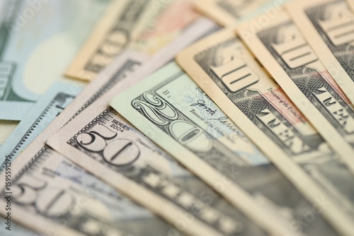 Many dollar bills banknotes in different denominations