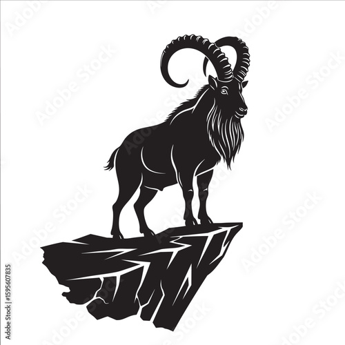 A majestic mountain ibex standing on a steep cliff silhouette