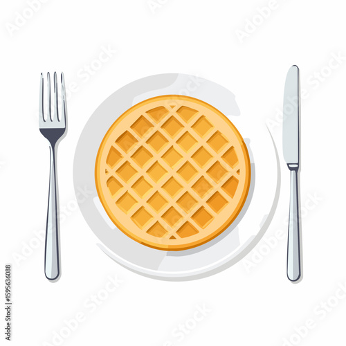 Waffle on a plate – Crispy waffle on a ceramic plate with fork beside.
