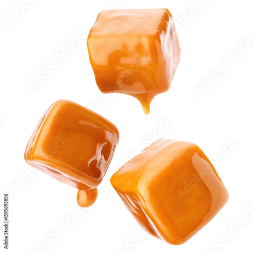 Salted caramel cubes floating in mid air concept. Three delicious caramel cubes dripping with rich golden sauce.