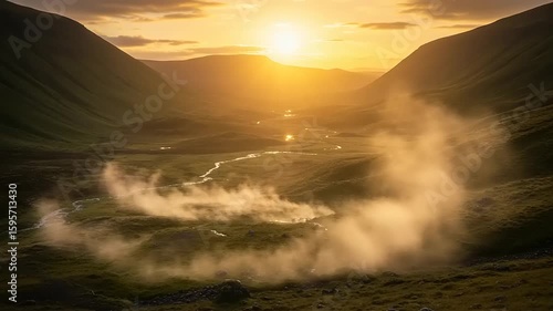 Mountain valley at sunset with dust clouds