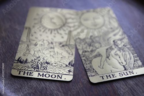 Mystical atmosphere captured through a detailed tarot card arrangement on a textured surface. Rich symbolism and traditional esoteric themes evoke intuition, divination, and spiritual insight. Ideal f