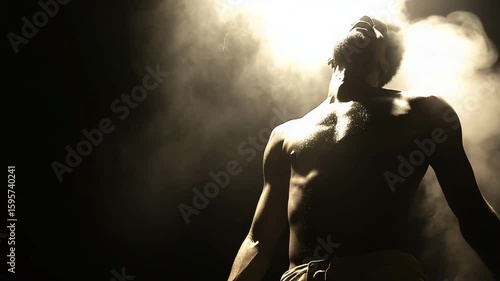 Mysterious shadowy silhouette of a man standing alone in the depths of darkness and obscurity