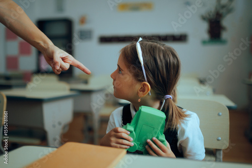 Quadro su tela Teacher Scolding Student For Playing with a Game Toy
