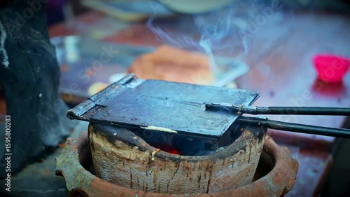 Food Series - Making Thong Muan dessert with a charcoal oven. Traditional Thai desserts. A street vendor is making crispy coconut roll.
