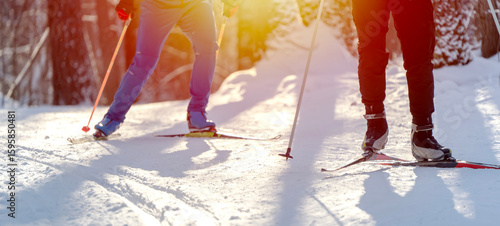 Schilderij op canvas Skiers Cross-Country Skiing in Snowy Forest