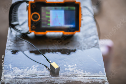 UT, Ultrasonic testing to detect imperfection or defect in welding of steel plate structure in factory. NDT Inspection.