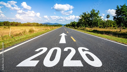 Wallpaper Mural A long road stretches forward with “2026” painted in bold white numerals on the asphalt, an arrow above signaling forward motion—evoking progress, hope, and journey into the future. Torontodigital.ca