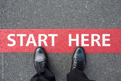 Start Here Concept with Black Shoes on Asphalt Road Ready to Take the First Step Towards a New Beginning