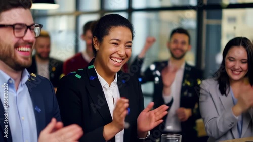 Corporate Team Celebrates Achievement with Joyful Applause and Confetti Shower