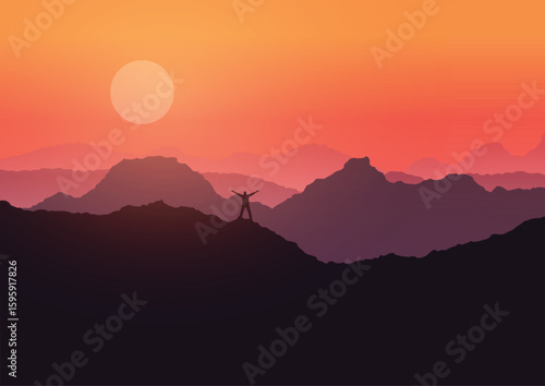man stood on mountain landscape at sunset 3107