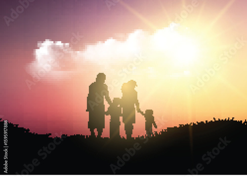 Silhouette of a family walking against a sunset sky