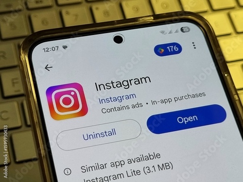 Instagram App uninstall or open from Play store on Android smartphone with screen Dynamic LTPO AMOLED on keyboard laptop. Pamekasan, Indonesia - Jul 20, 2025.