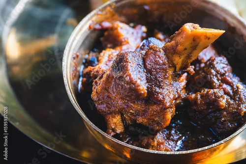 Traditional Bengali-style mutton kosha – spicy slow-cooked Indian goat curry, kosha mangsho, authentic Bengali mutton dish, homestyle non-veg curry, festive meat preparation, rustic top view