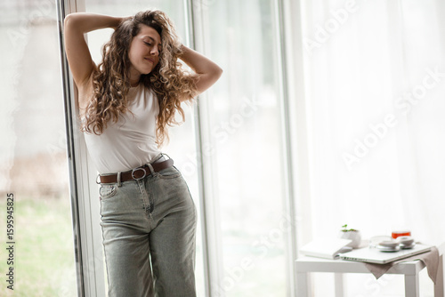 Free Download the girl at home admires the view from the window and enjoys a passive weekend - GFXLoad