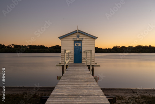A boathouse during sunrise along the Maroochy River on the Sunshine Coast in Australia