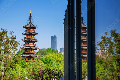 Photography Longhua pagoda as flak cannon tower with reflection on building mirror