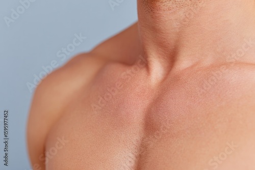 Wallpaper Mural close-up of tight-lipped person holding chest with furrowed brows on solid color background Torontodigital.ca