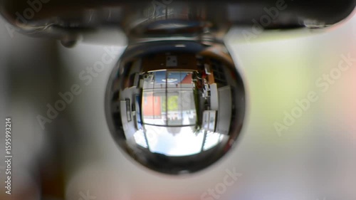 Refraction in a Water Droplet Urban Scene Mirrored in Miniature