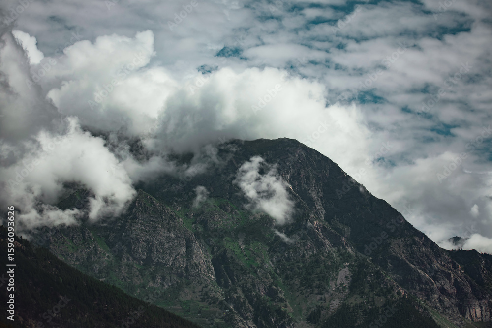 Fototapeta premium Dense clouds over the mountain in Himachal