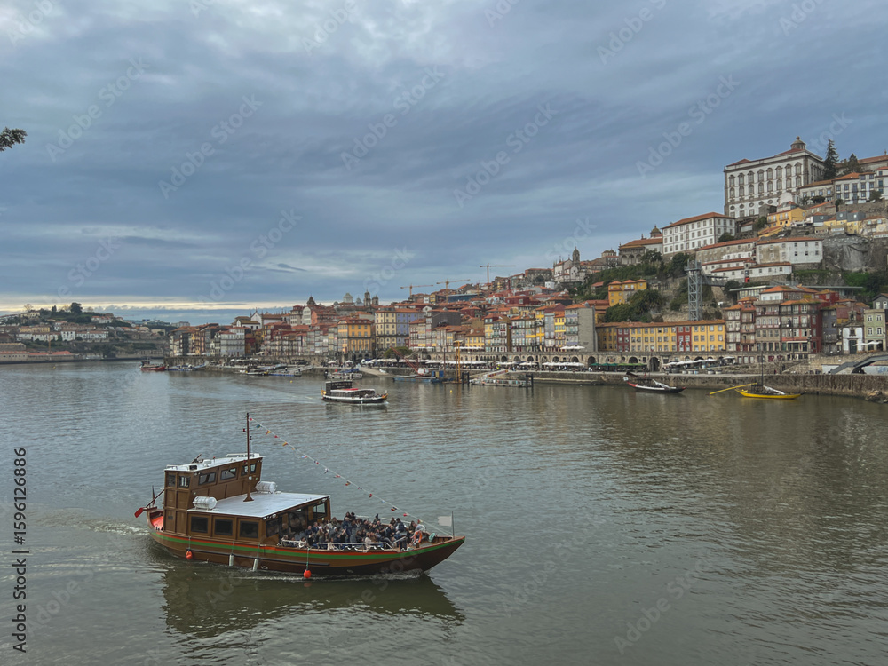 Fototapeta premium Romantic backstreet, side street or alley in historic old town of Porto Oporto, Portugal with colonial colorful tile style architecture facades, a landmark sightseeing tourist spot in old town