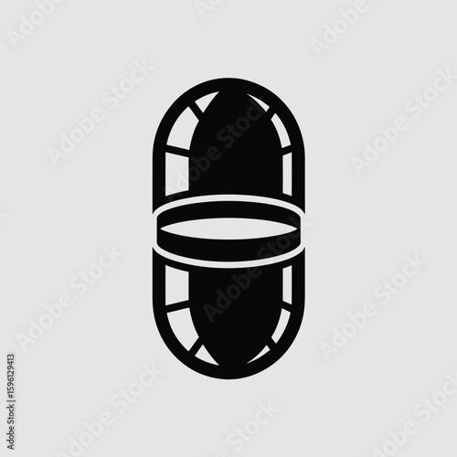 Stylized black and white graphic of a medication capsule with a bold design and unique cutouts, ideal for pharmaceutical or health-related concepts and creative projects