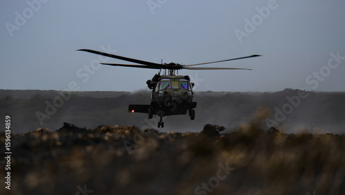 Military Black Hawk Helicopter Low-Level Flight, Dramatic Silhouette, Volcanic Landscape