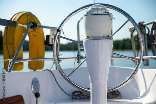 Close-Up of Yacht Steering Wheel and Compass on a Sunny Day