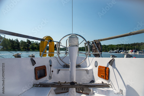 Steering View from Yacht Cockpit on a Sunny Day at Marina