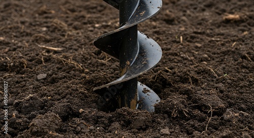 Wallpaper Mural Black Metal Auger Drilling into Rich Dark Soil Torontodigital.ca
