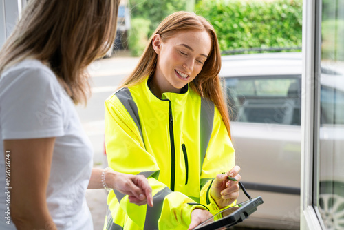 Konstfotografi Young professional female representing energy supplier  customer service visitin