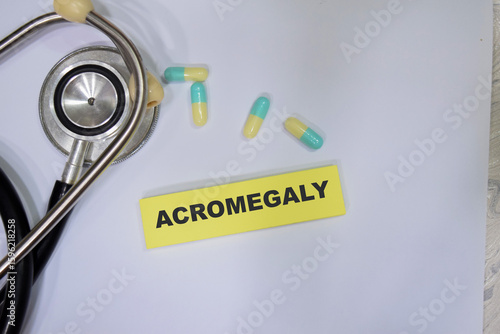 Concept of Acromegaly write on sticky notes isolated on Wooden Table. healthcare and pharmaceutical concept