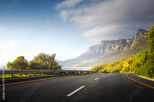 Scenic Coastal Road through Cape Town Suburbs with Mountains and Ocean View
