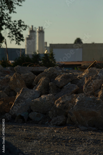 Photography In the foreground, there is a varied and somewhat haphazard pile of rocks, with