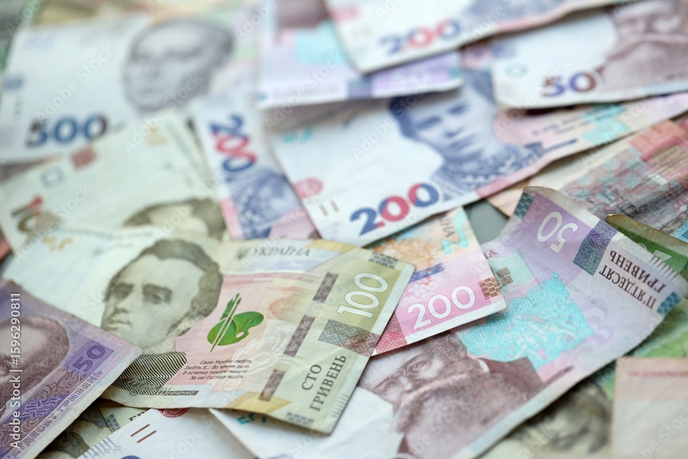 Big amount of different ukrainian hryvnia currency money bills in pile Big amount of different ukrainian hryvnia currency money bills in pile
