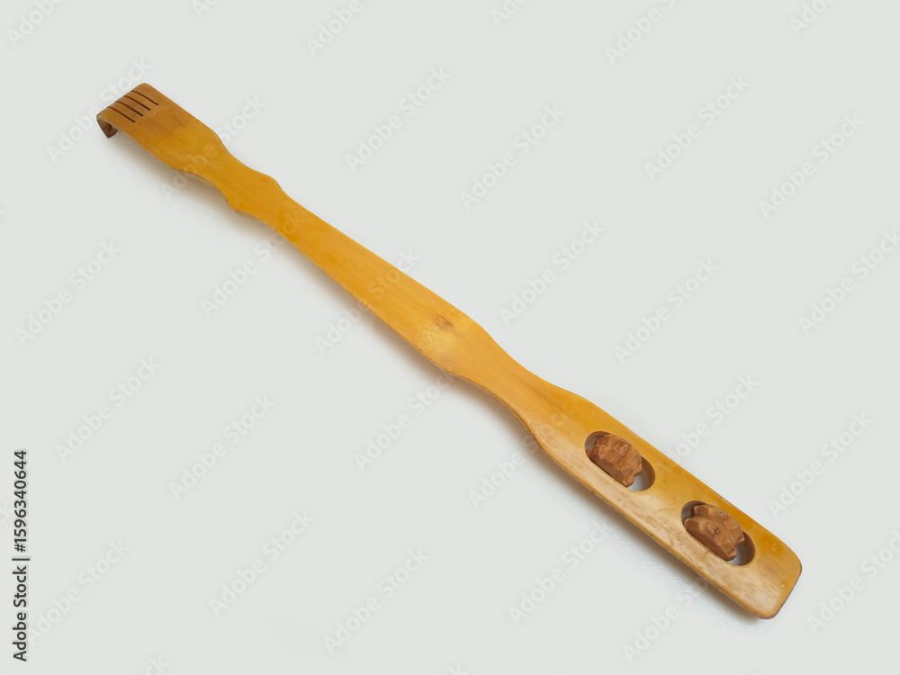 A wooden back scratcher on a white background, back side, a hand shaped itch relief tool with long handle A wooden back scratcher on a white background, back side, a hand shaped itch relief tool with long handle