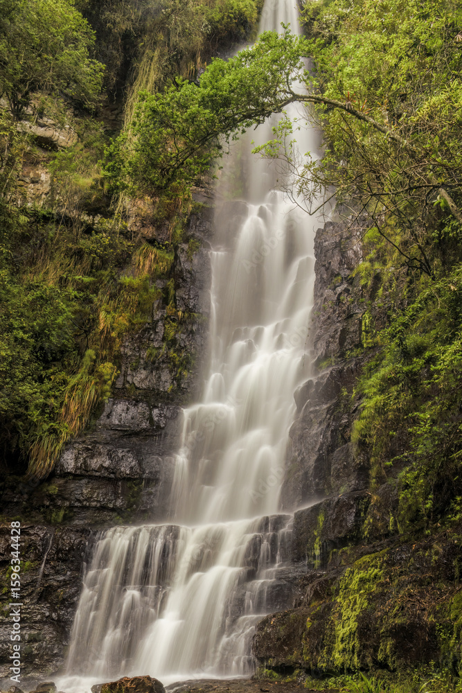 Fototapeta premium View of the waterfall Chontales in long exposure shot, in the eastern Andean mountains of central Colombia, near the town of Sotaquira.