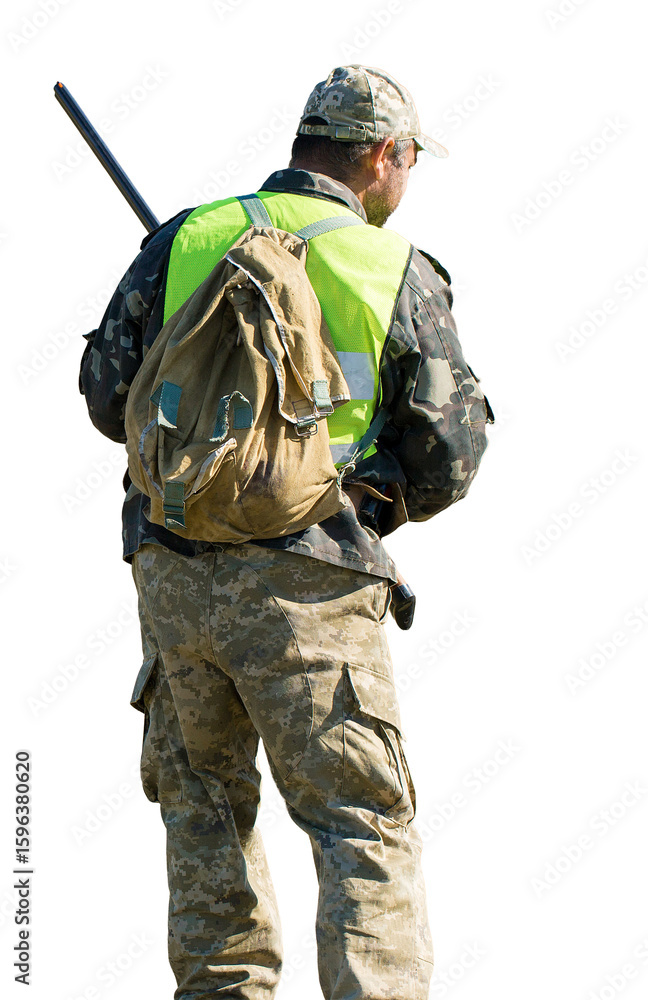 Obraz premium Hunter man in camouflage with a gun during the hunt in search of wild birds or game.