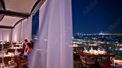 Elegant rooftop restaurant ambiance with cityscape views in the evening twilight