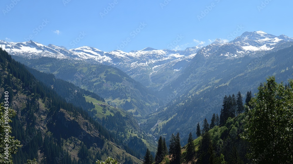 Fototapeta premium Serene mountain landscape with snow-capped peaks, green valleys, and a clear blue sky in natural harmony