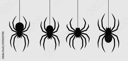 Four black spiders hanging on silken threads against a light gray background