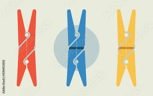 Three colorful clothespins arranged vertically on a light background