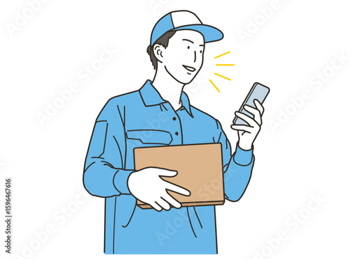 荷物を持ちながらスマホを使う配達スタッフ