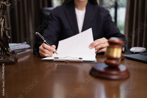 Lawyer Businesswoman Working with Documents and Signing Contract at Office Desk, Hammer on Wood table, Judge's Gavel, Law, Justice Symbol,